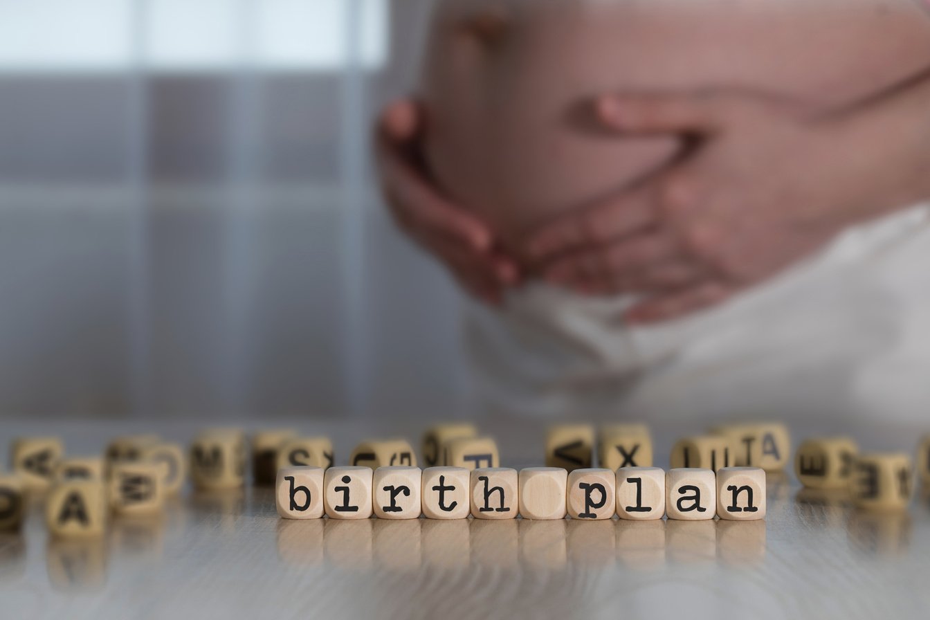 Words BIRTH PLAN composed of wooden letters.