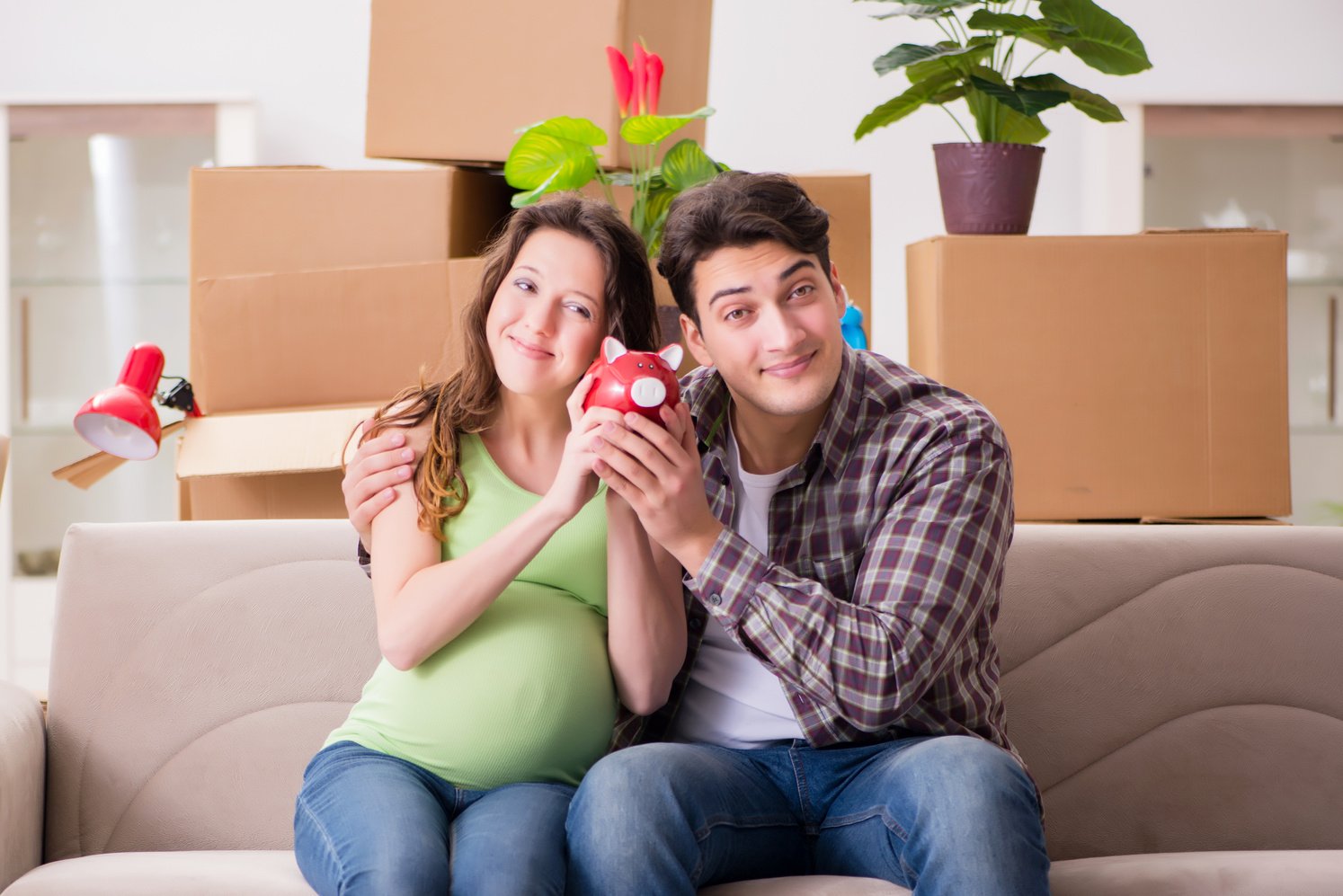 Young Couple Saving Money for Baby 