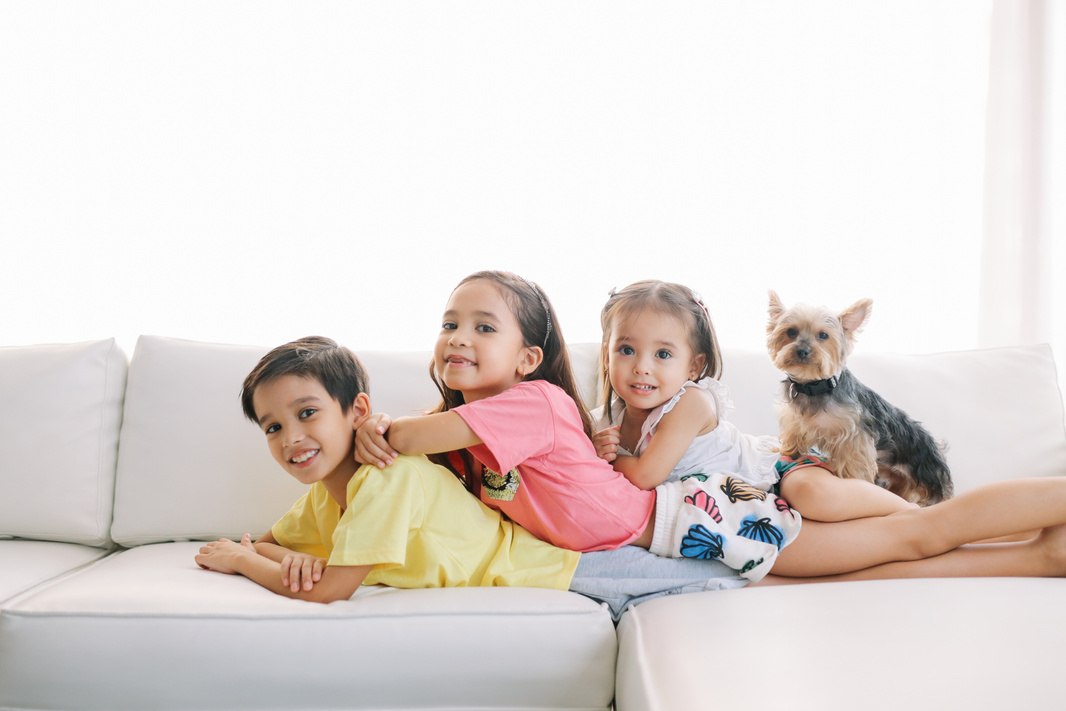 Siblings and Dog on the Sofa