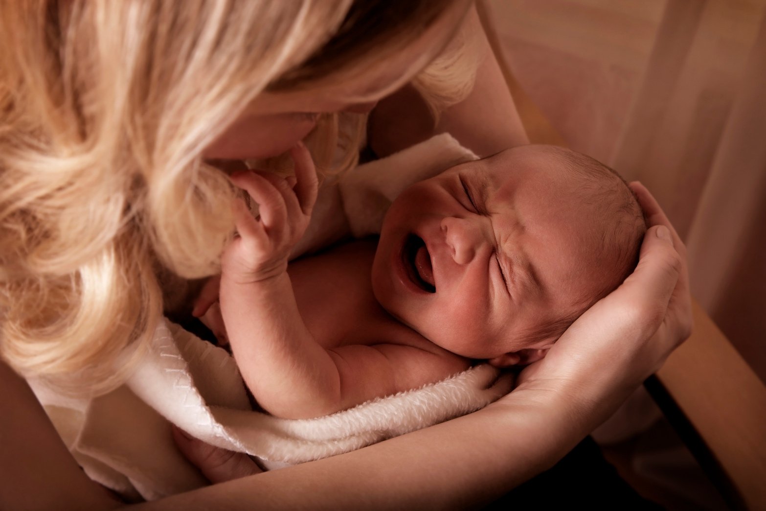 Mother Soothing a Crying Baby