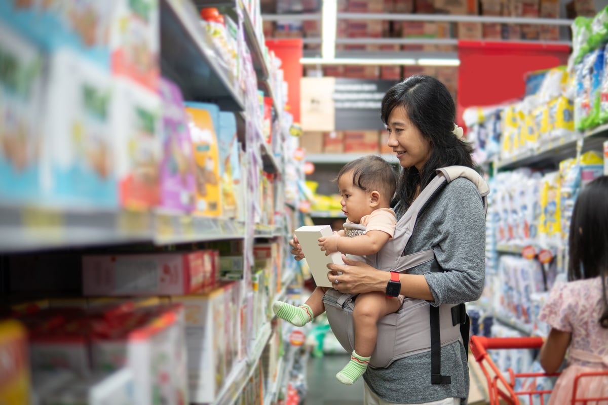 Mother Buying Baby Product with Daughter