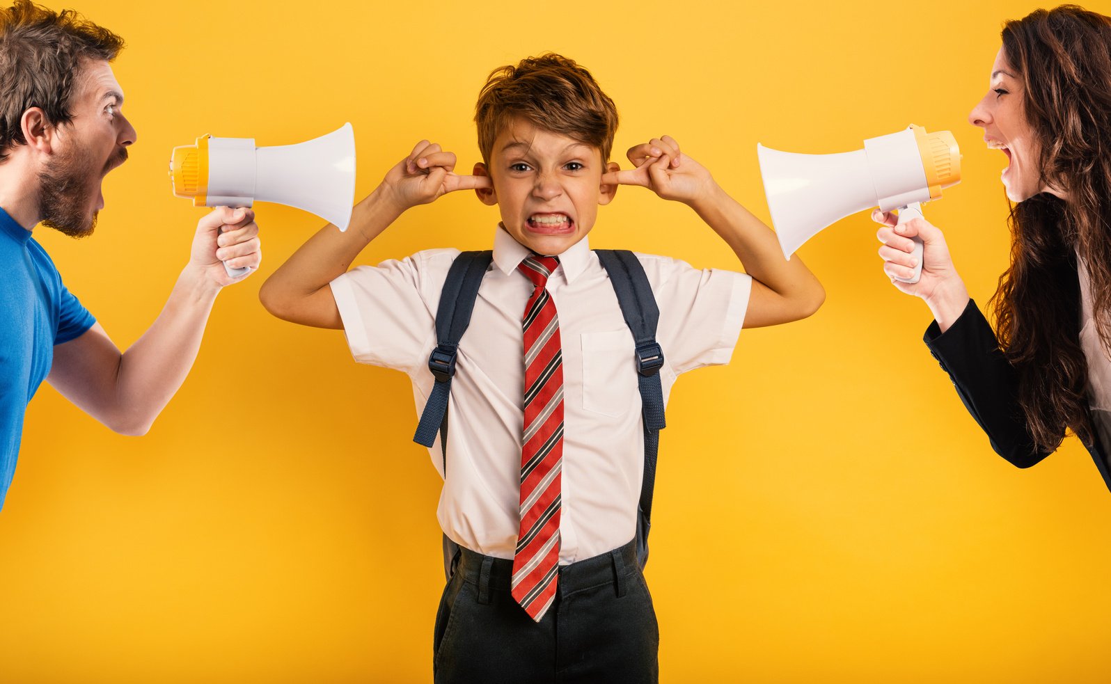 Student Child Covers His Ears Because He Does Not Want to Hear Reproach of the Parents. Yellow Background